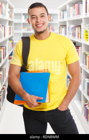 Student young man portrait format library learning smiling people learn Stock Photo