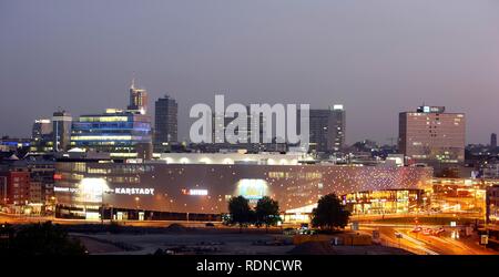 Skyline of Essen and Limbecker Platz shopping center, completed in 2009, Essen city centre, illuminated facade on Berliner Platz Stock Photo