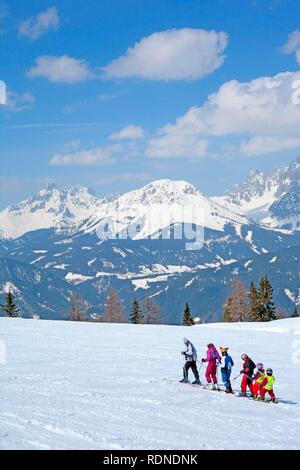 Young family skiing, Reiteralm, Styria, Austria, Alps, Europe Stock Photo