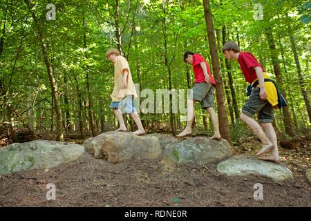Young people walking along a barefoot path in Egestorf on the Lueneburg Heath, Lower Saxony Stock Photo