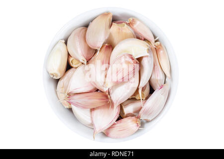 Garlic cloves from above bowl isolated on a white background Stock Photo
