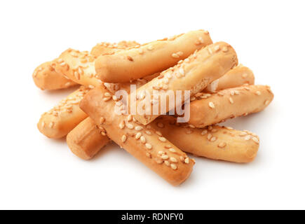 Pile of breadsticks with sesame isolated on white Stock Photo