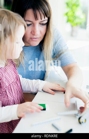 Mother and daughter playing Stock Photo