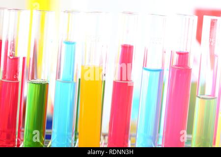 Chemistry laboratory, various glass containers with liquids, chemicals, in various colors Stock Photo