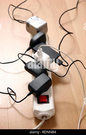 Multiple power strips for connection of multiple electrical devices, connectors and power supply units Stock Photo
