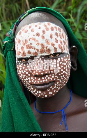 Young Surma woman with traditional body painting, Kibish, Omo valley, Ethiopia, Africa Stock Photo