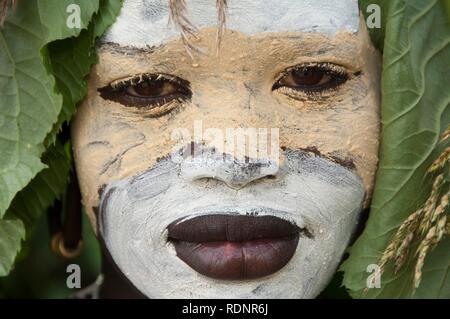 Surma woman portrait with face painting, Kibish, Omo valley Valley, Ethiopia, Africa Stock Photo