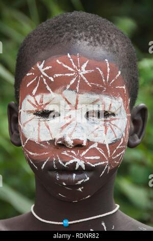 Surma boy with facial painting, Kibish, Omo River Valley, Ethiopia, Africa Stock Photo