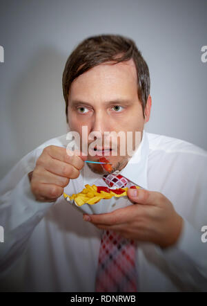 Man eating fast food Stock Photo