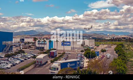 Malaga, Spain - April 07, 2018. Airplane landing over the shopping center Bahia Azul, Malaga, Spain Stock Photo