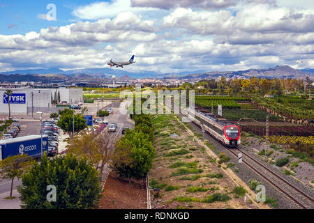 Malaga, Spain - April 07, 2018. Airplane landing over the shopping center Stock Photo