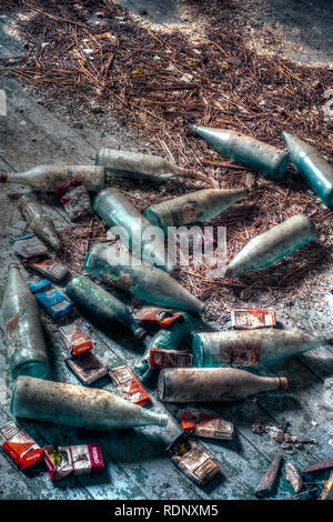 Ruse city, Bulgaria - November 07, 2017. Dusty bottles and packs of cigarettes forgotten over time Stock Photo