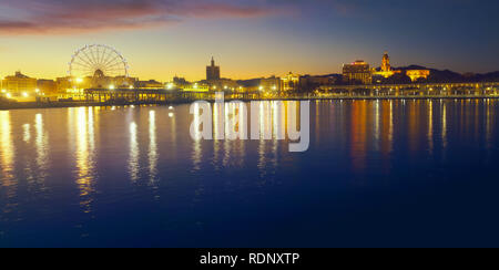 Panoramic view of Malaga city from harbour at sunset Stock Photo