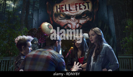 Hell Fest is a 2018 American slasher film directed by Gregory Plotkin, and written by Seth M. Sherwood, Blair Butler, and Akela Cooper, from a story by William Penick, Christopher Sey and Stephen Susco. The film stars Amy Forsyth, Reign Edwards, Bex Taylor-Klaus, and Tony Todd,    This photograph is for editorial use only and is the copyright of the film company and/or the photographer assigned by the film or production company and can only be reproduced by publications in conjunction with the promotion of the above Film. A Mandatory Credit to the film company is required. The Photographer sho Stock Photo