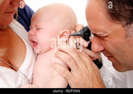 Doctor's surgery, mother and child at the paediatrician's, medical examination of an infant, preventive medical examination Stock Photo