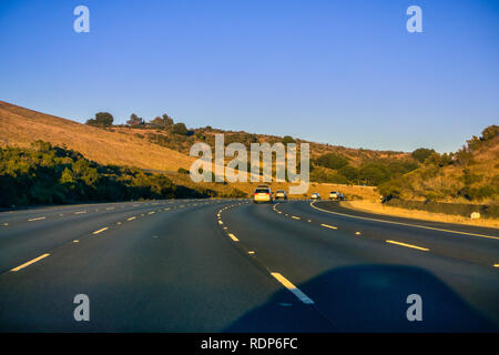 Highway winding through hills at sunset, San Francisco bay area,, California Stock Photo