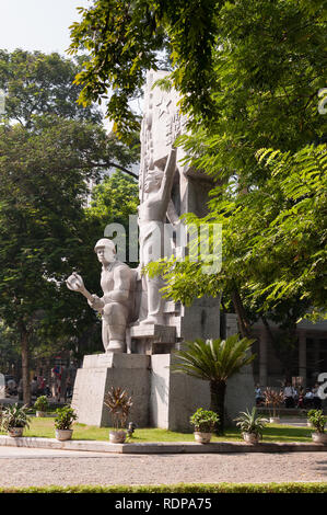 Large stone monument to the 1946 communist revolution in northern Vietnam at Hang Dau Park, Hanoi, Vietnam Stock Photo