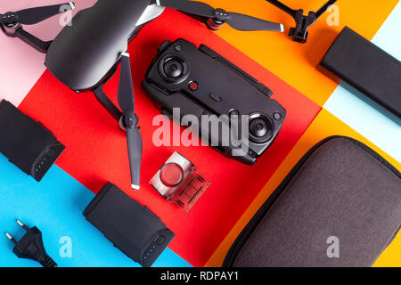 control panel, drone and its accessories on a colorful background Stock Photo