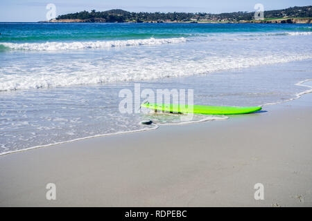 Abandoned surf board on the beach, Carmel-by-the-Sea, Monterey Peninsula, California Stock Photo