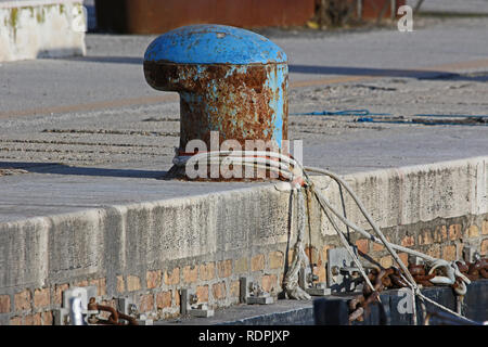 mooring post for fishing boats in the port in Numana Italy near Ancona on the Adriatic Riviera Stock Photo