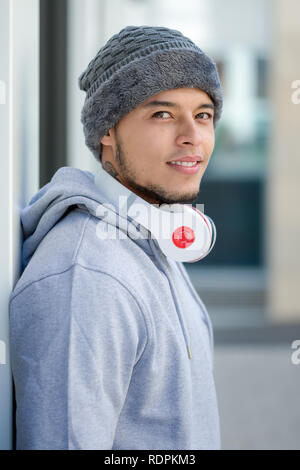 Sports training young latin man winter cold portrait format runner outdoor Stock Photo