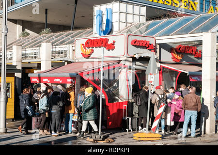 Berlin, Germany - january 2019:   People at   Curry 36, the most famous curry sausage fast food restaurant  in Berlin, Germany, Stock Photo