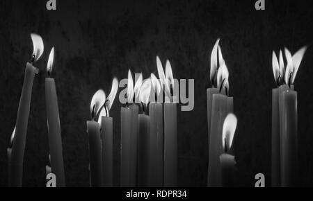 Candles of prayers in one of the oldest churches in Egypt,group of votive candle wax Stock Photo