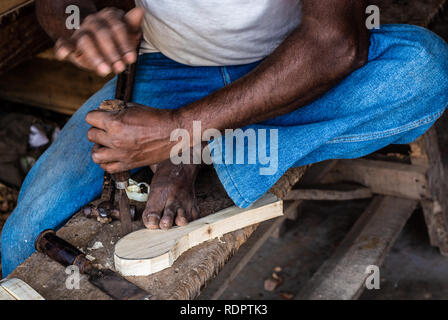 Working Hands with wood carving hand tools for wood art work Stock Photo