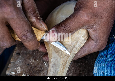 Working Hands with wood carving hand tools for wood art work Stock Photo