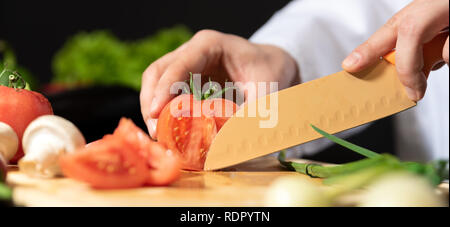 Chef prepares fresh vegetables. Cooking, healthy nutrition concept Stock Photo