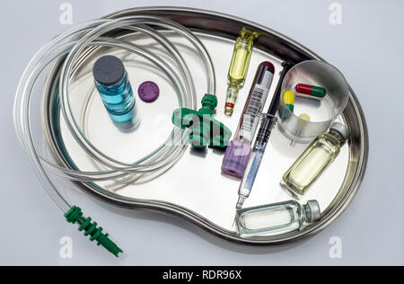 Several vials and medicines in a tray metal in a hospital, conceptual ...