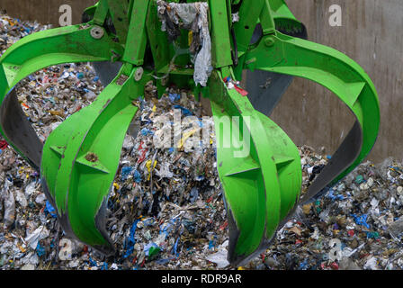 GERMANY, Stavenhagen, depot for garbage, hydraulic gripper put the waste in a burning chamber, the plastic waste is burned to generate electric energy Stock Photo