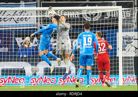 Sinsheim, Germany. 18th Jan, 2019. Manuel NEUER, FCB 1 compete for the ball, tackling, duel, header, action, fight against Florian GRILLITSCH, Hoff 11 fights for the ball, catches, catch, hold, defend, action, frame, cut out, reaction, fist, 1899 HOFFENHEIM - FC BAYERN MUNICH 1-3 - DFL REGULATIONS PROHIBIT ANY USE OF PHOTOGRAPHS as IMAGE SEQUENCES and/or QUASI-VIDEO - 1.German Soccer League in Sinsheim, Germany, January 18, 2019 Season 2018/2019, matchday 18, FCB, München, Credit: Peter Schatz/Alamy Live News Stock Photo