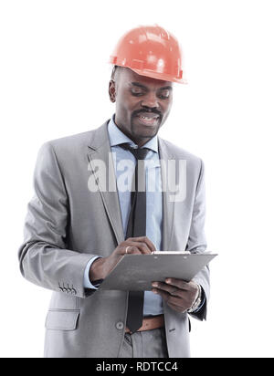 Happy african american construction worker holding blueprints isolated on white. Stock Photo