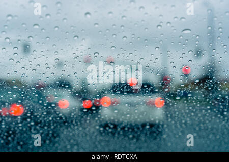 Heavy traffic during a rainy day; raindrops on the window Stock Photo