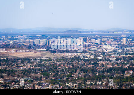 Aerial view of downtown San Jose on a clear day; residential neighborhoods in the foreground; Santa Clara and San Francisco bay in the background; Sil Stock Photo