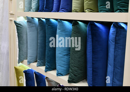 Many decorative pillows on the shop window Stock Photo