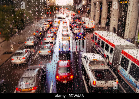 traffic in the rain, take from the plus15 bridge, rush hour traffic  through a rainy window, commuters Stock Photo