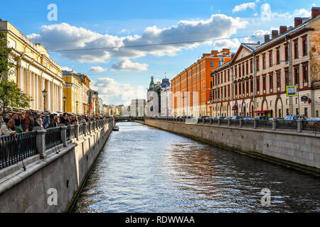 St. Petersburg, Russia - September 10 2018: Tourists crowd the square of the Spilled Blood Cathedral next to Griboyedov Channel off the Moyka River Stock Photo