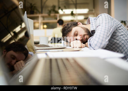 Sleeping at work Stock Photo