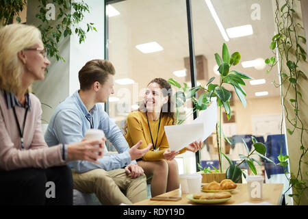 Colleagues discussing papers Stock Photo