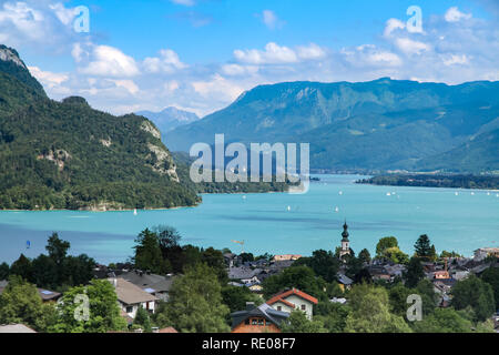 Landscape scenic view on Wolfgangsee lake in Salzkammergut, Austria from a high vantage point. Scenery of St. Gilgen with Alps clear blue water lake a