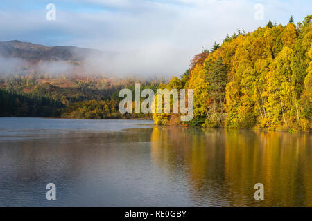 Early morning mist rising off Loch Faskally near Pitlochry, Perthshire, Scotland Stock Photo