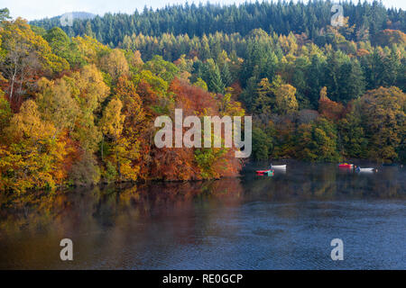 Colourful boats on Loch Faskally near Pitlochry, Perthshire, Scotland Stock Photo