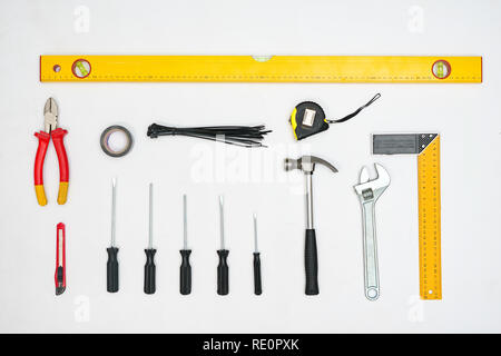 Flat lay of arranged tools and instruments in strict order on white background Stock Photo