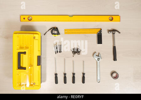 Top view of composed toolbox with instruments in order on wooden table Stock Photo