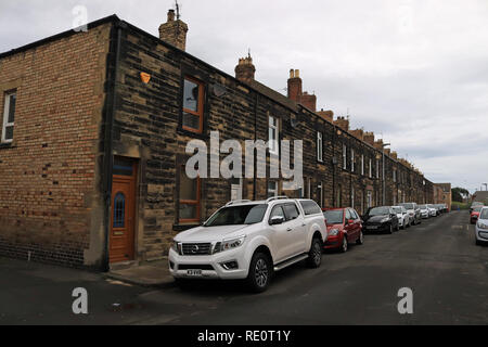 Terraced housing in Amble George Street in Amble.  Amble is a small town on the north east coast of Northumberland in North East England. It was a f Stock Photo