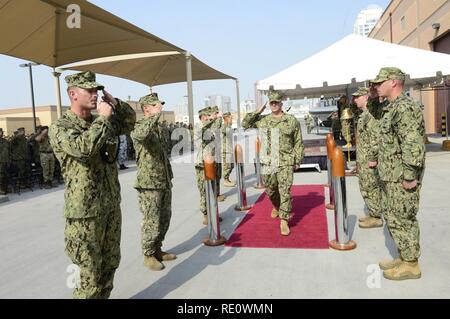 Capt. Bradley Andros, Commander, Task Force (CTF) 56, reads his orders ...