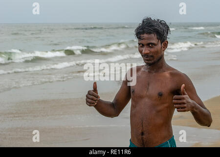A young Indian man on Marina Beach near Chennai in southern India