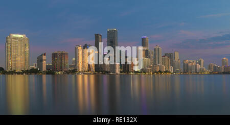Panorama of the Miami skyline at dawn from underneath the William M. Powell Bridge (Rickenbacker Causeway) in Miami, Florida Stock Photo